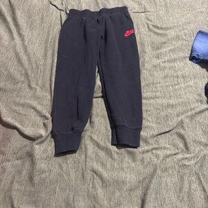 Nike Kids Navy Joggers with Red Logo
